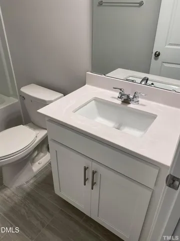 a bathroom with a sink and a toilet
