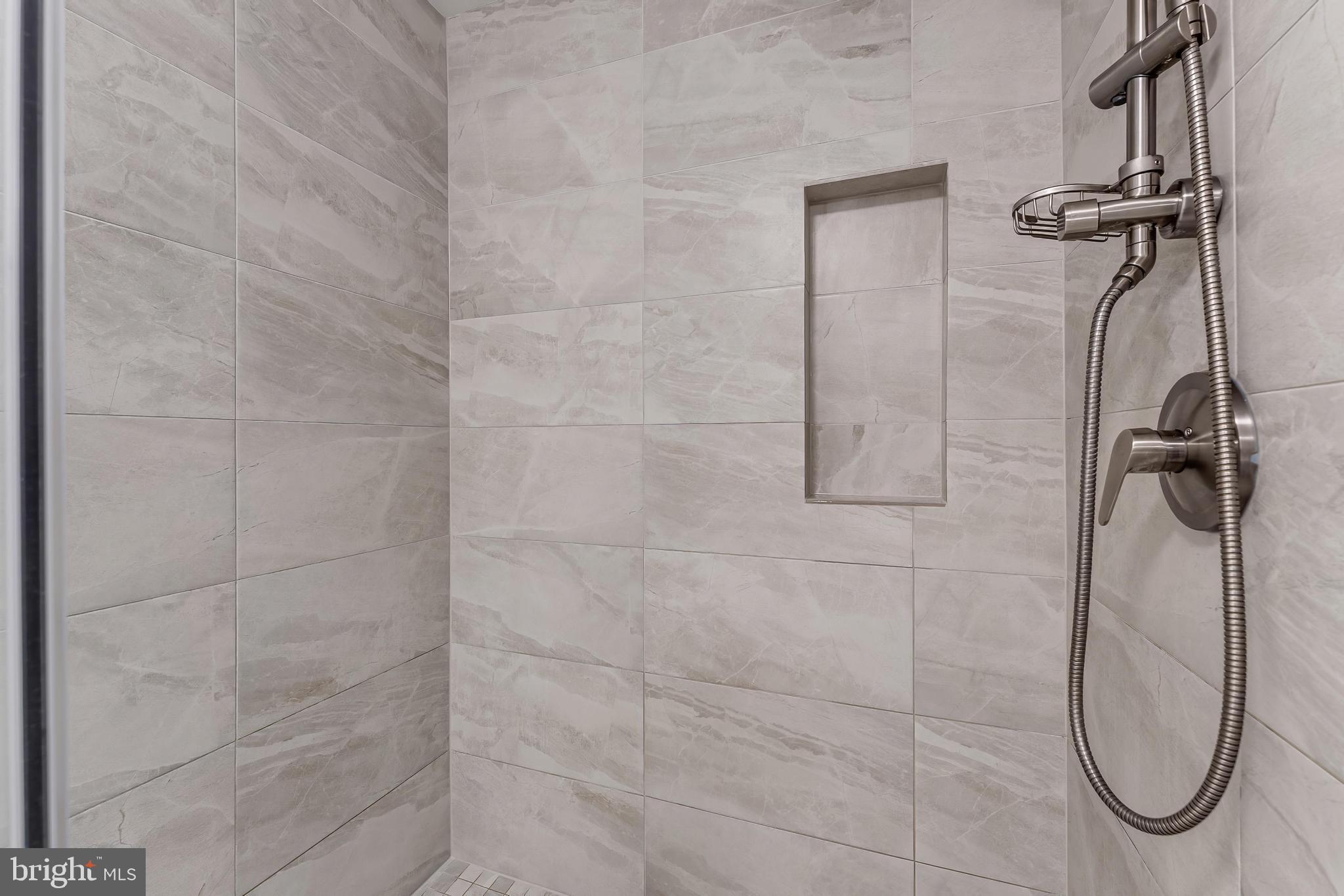 1483 Church Hill Place Reston, VA 20194 - Photo 15 of 38 a bathroom with a shower