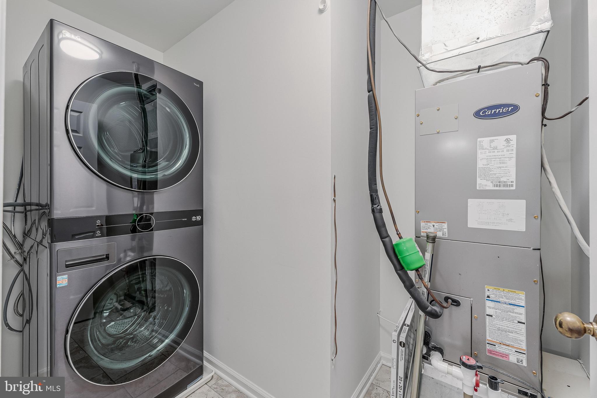 1483 Church Hill Place Reston, VA 20194 - Photo 24 of 38 a view of a hallway with washer and dryer