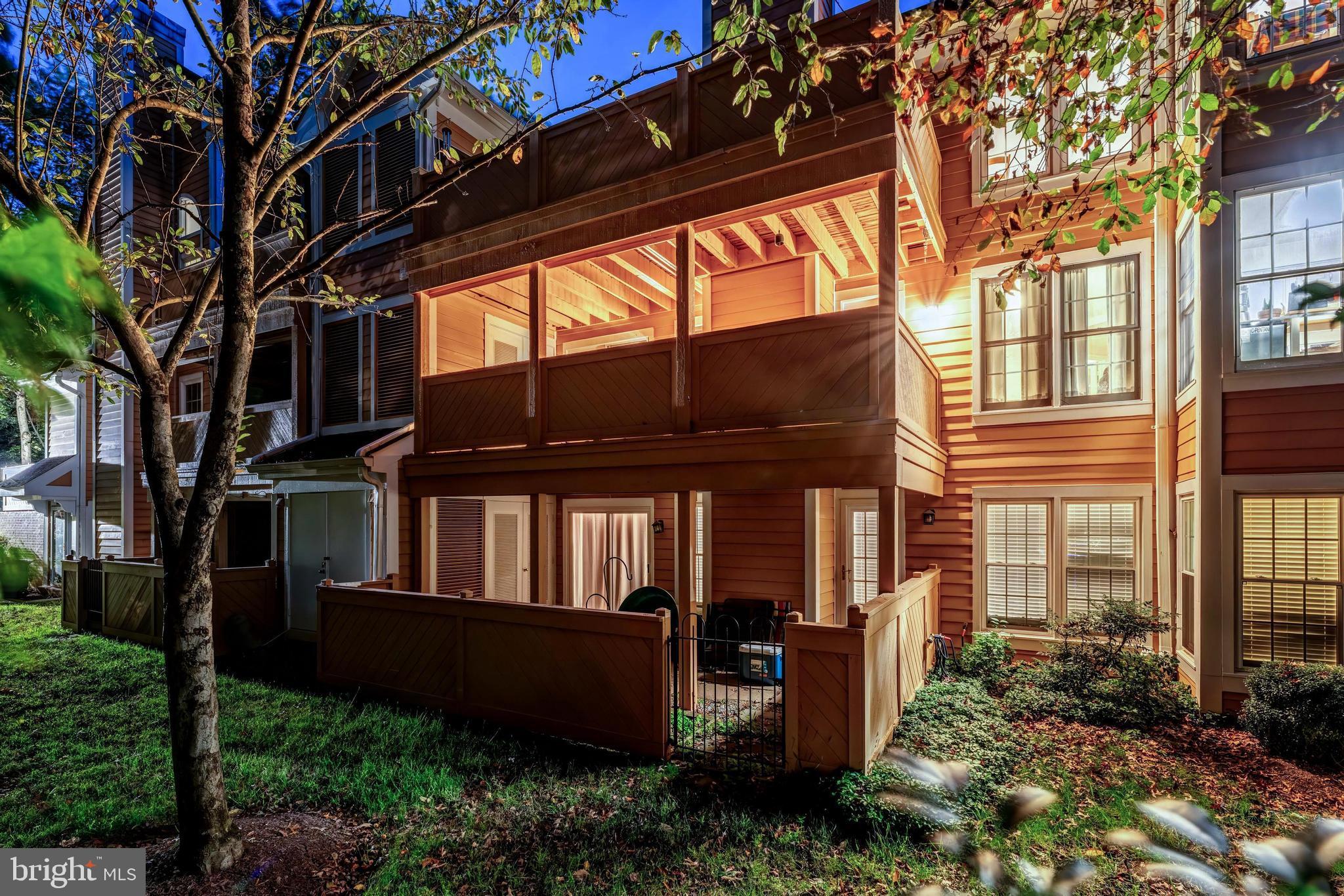 1483 Church Hill Place Reston, VA 20194 - Photo 27 of 38 a view of brick house with a large window and potted plants