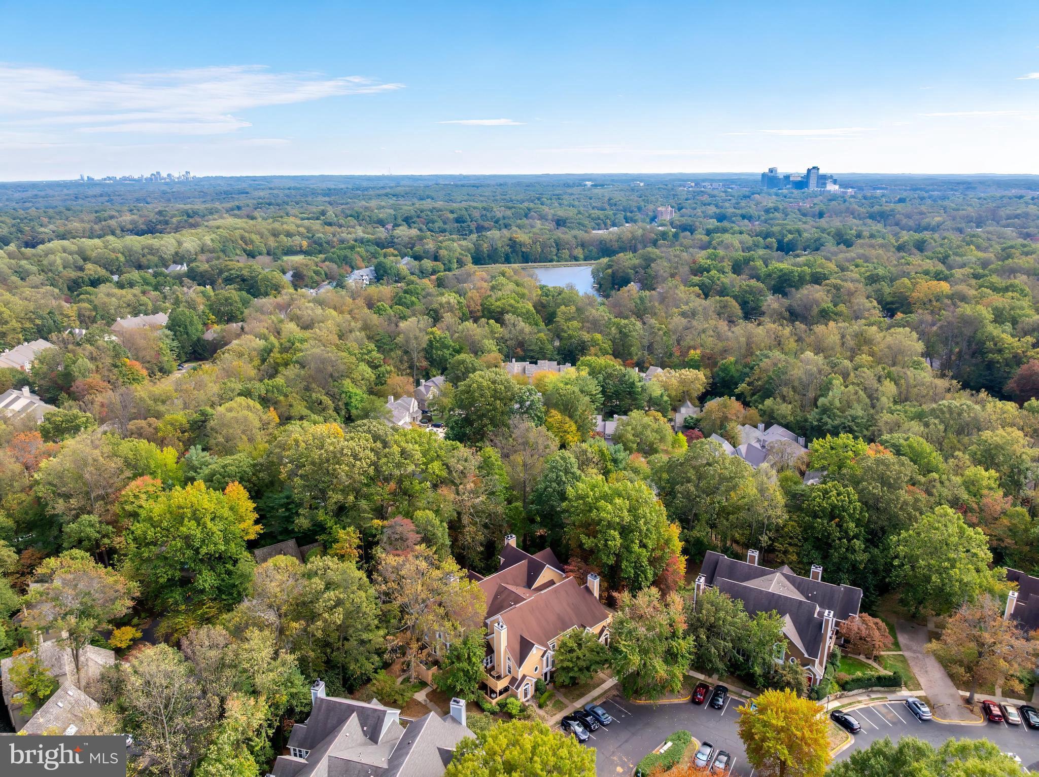 1483 Church Hill Place Reston, VA 20194 - Photo 35 of 38 an aerial view of a city with lots of residential buildings and mountain view in back