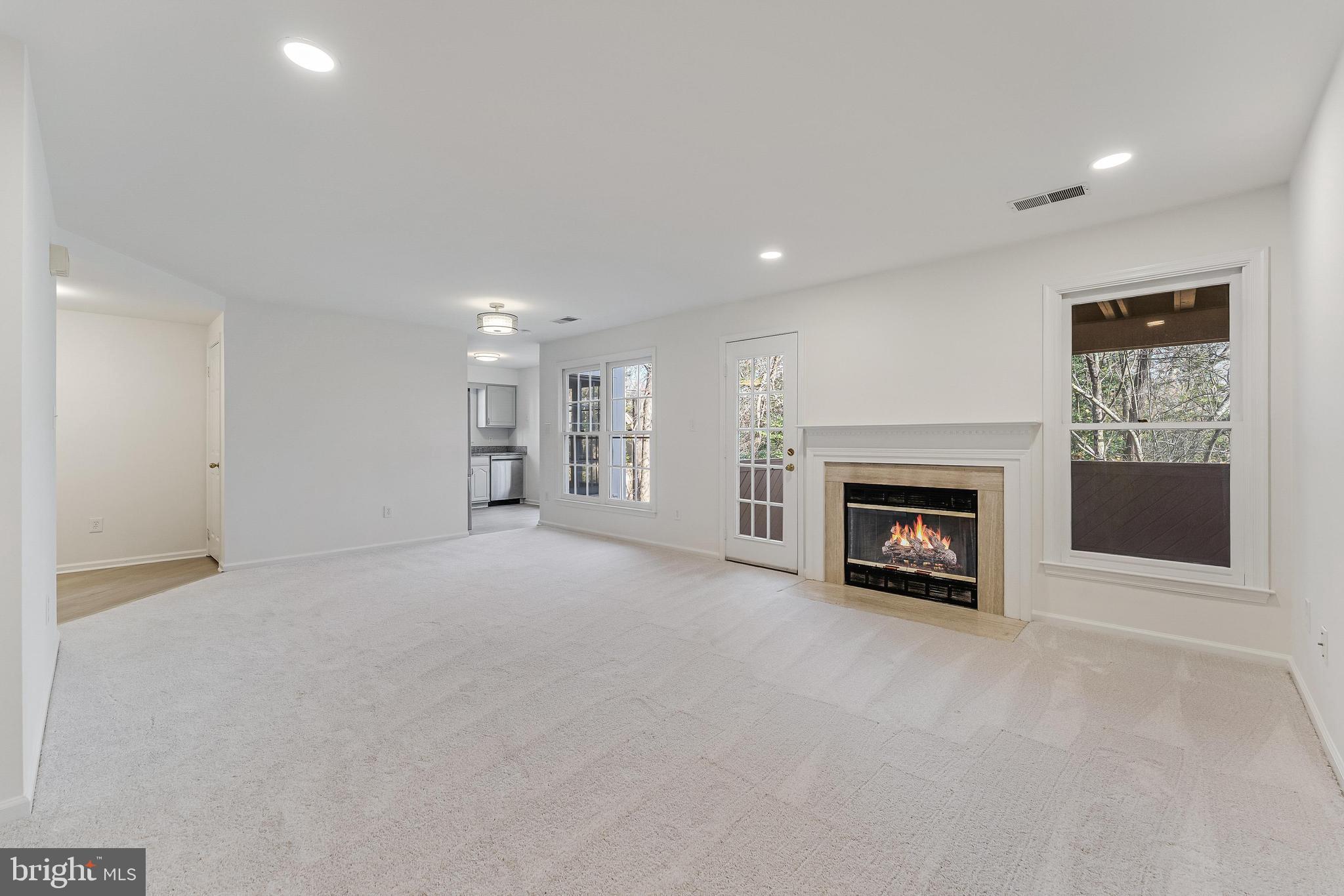 1483 Church Hill Place Reston, VA 20194 - Photo 8 of 38 a view of an empty room with a fireplace