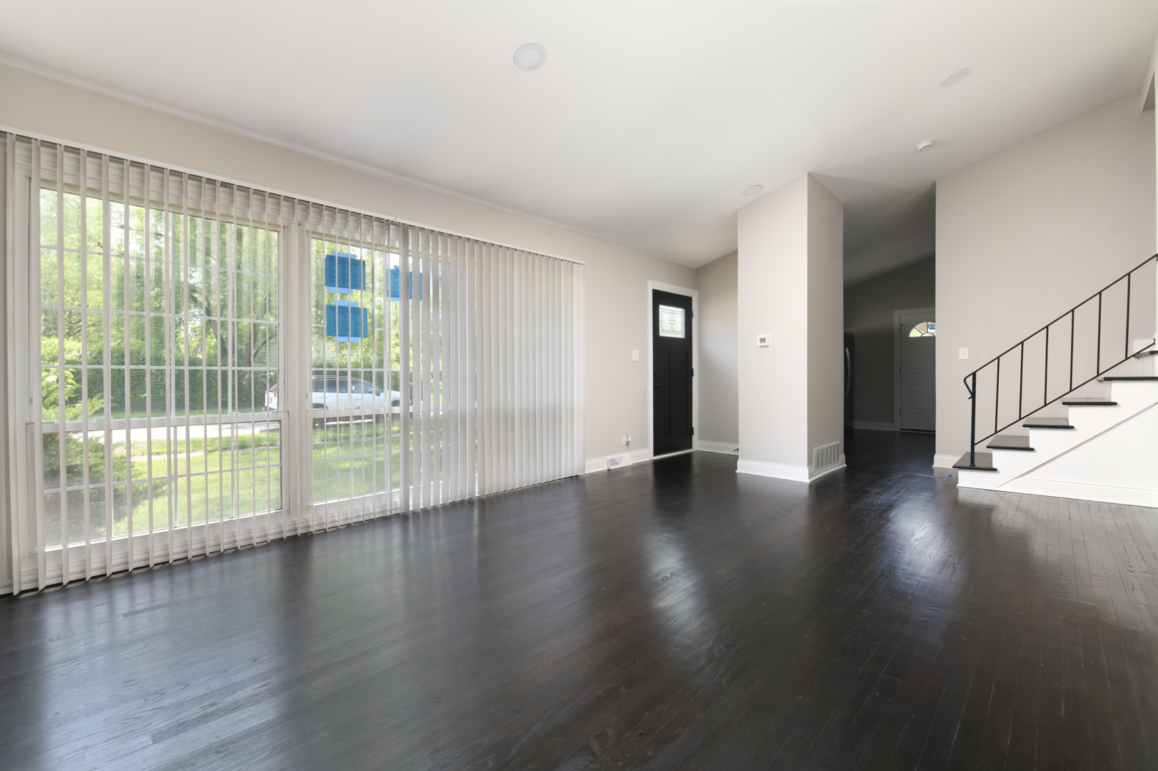 3402 Roesner Drive Markham, IL 60428 - Photo 11 of 23 a view of an empty room with wooden floor and a window