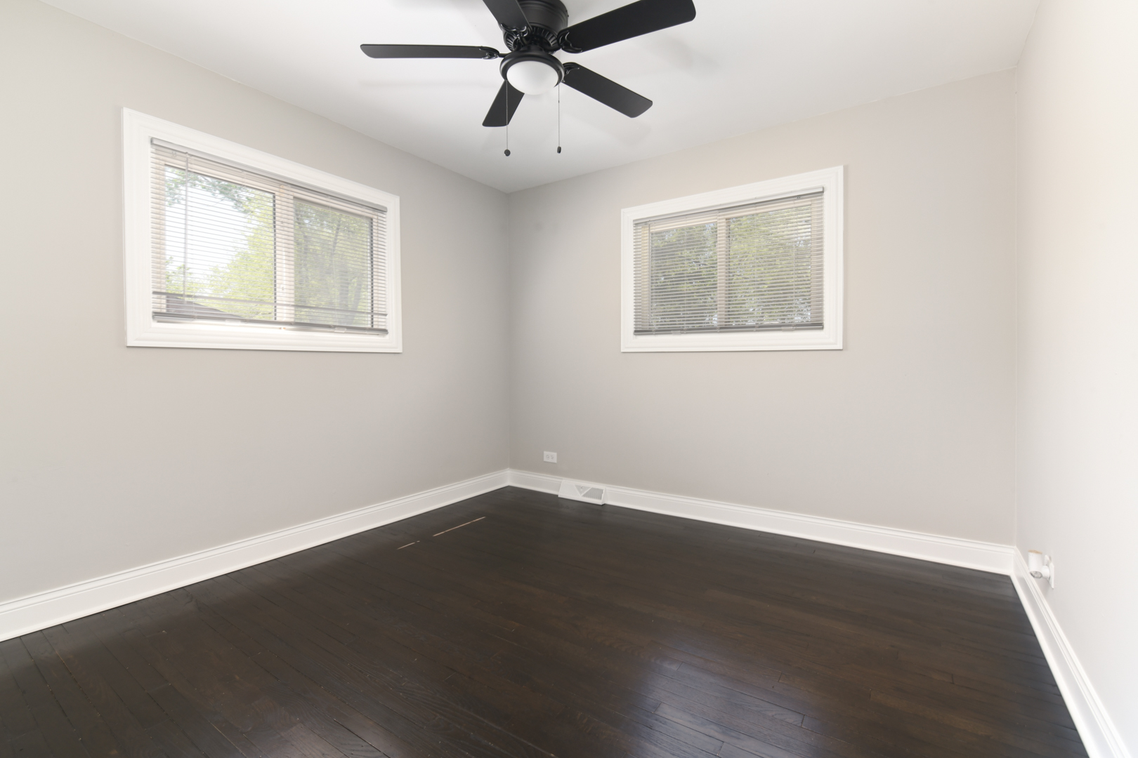 3402 Roesner Drive Markham, IL 60428 - Photo 12 of 23 a view of an empty room with wooden floor and a window