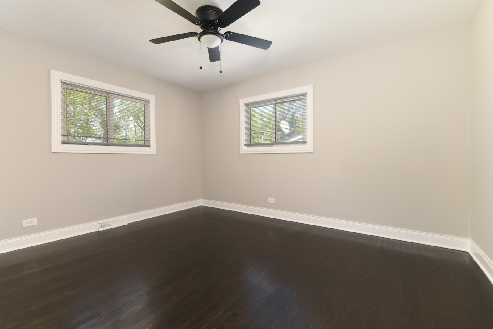 3402 Roesner Drive Markham, IL 60428 - Photo 13 of 23 a view of an empty room with wooden floor and a window