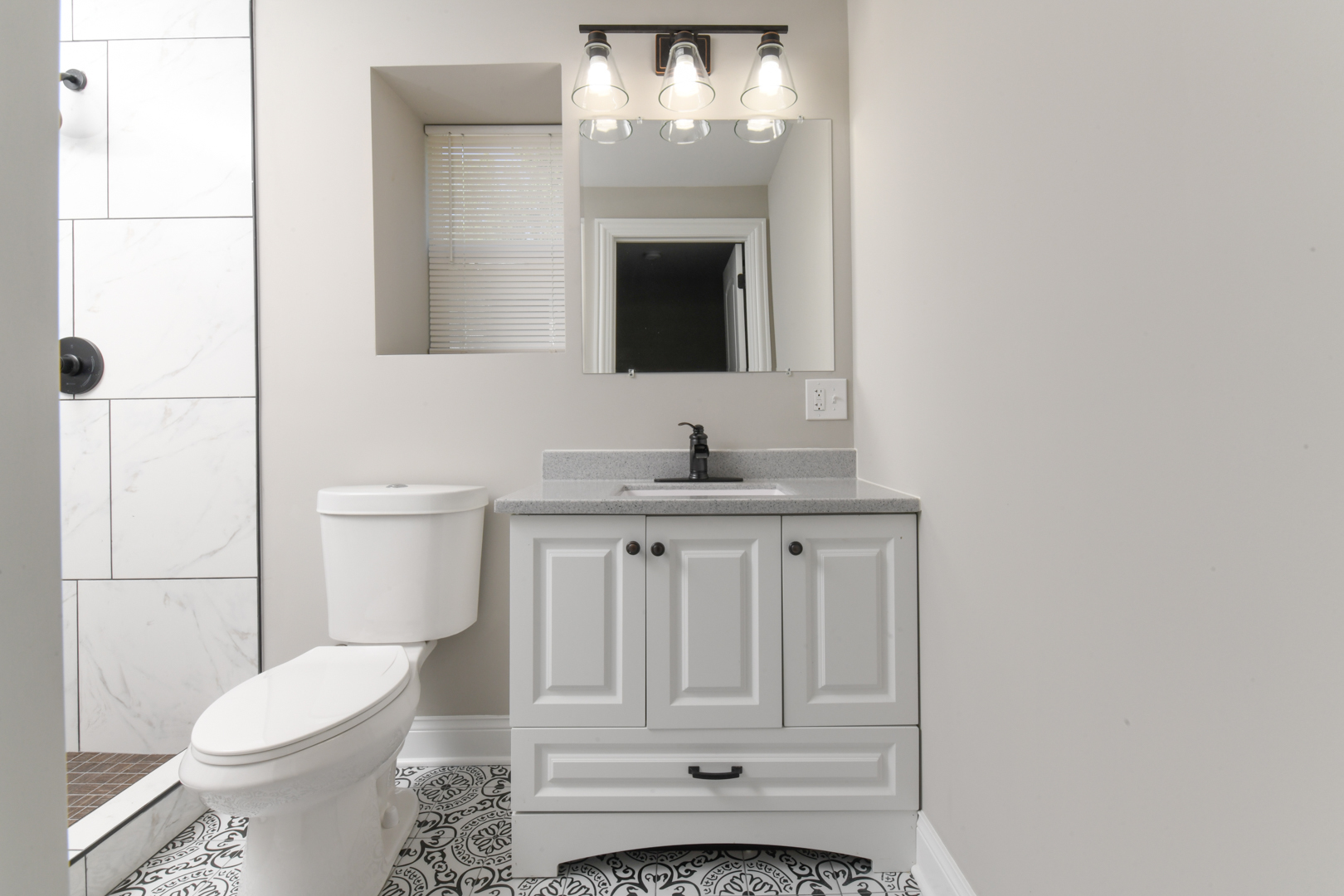 3402 Roesner Drive Markham, IL 60428 - Photo 18 of 23 a bathroom with a toilet sink and mirror