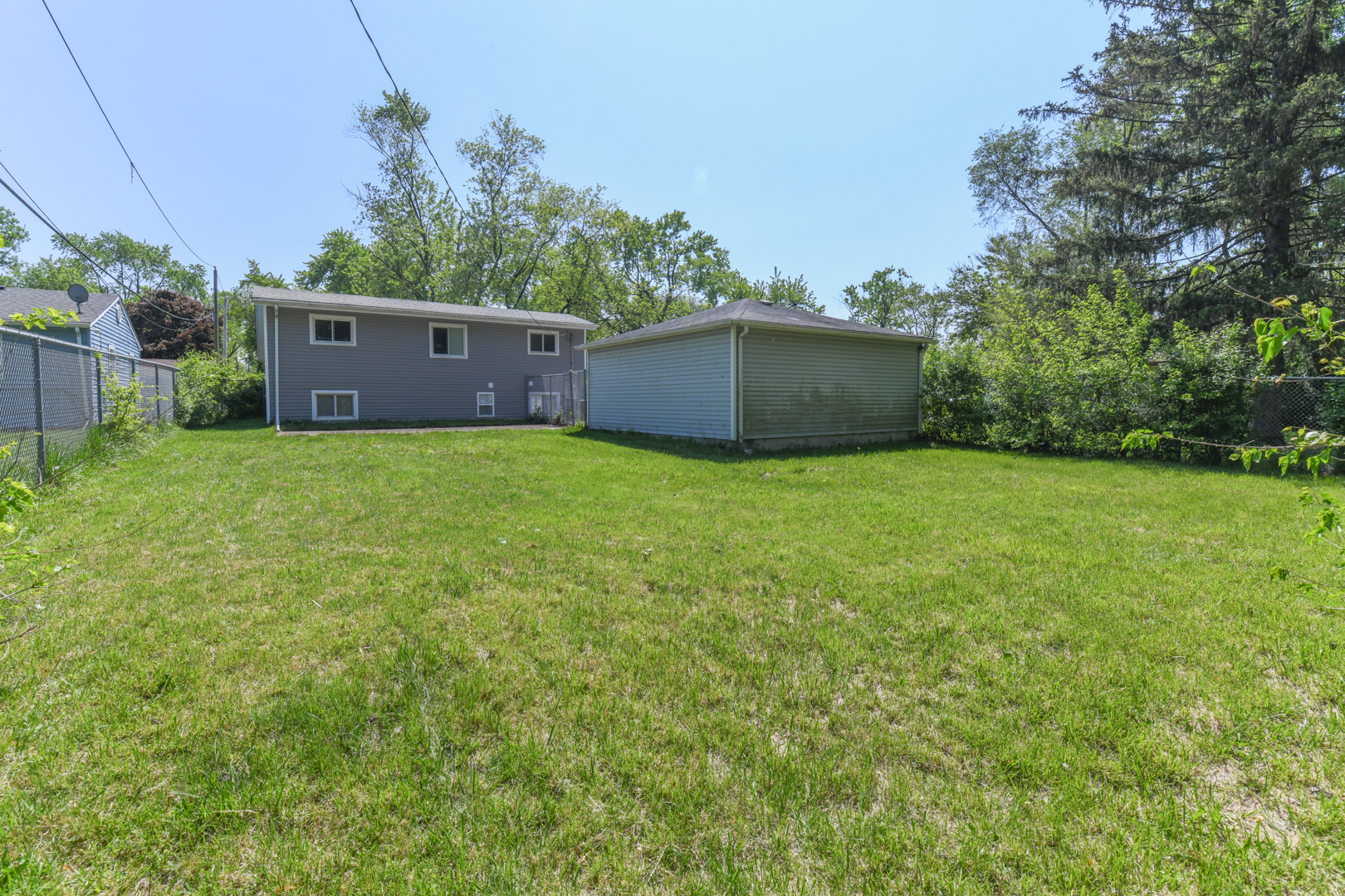 3402 Roesner Drive Markham, IL 60428 - Photo 23 of 23 a view of a house with a yard and a large tree