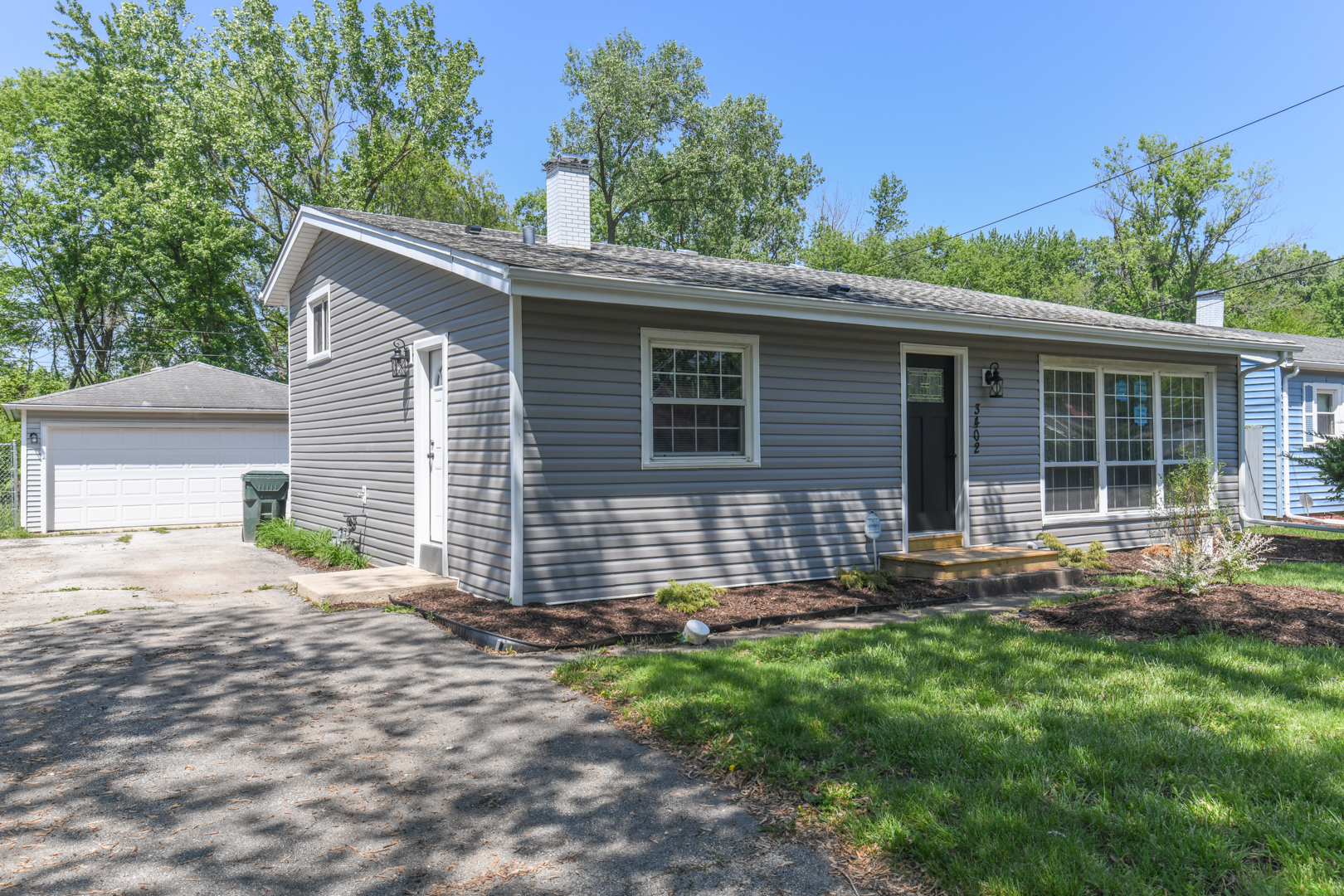 3402 Roesner Drive Markham, IL 60428 - Photo 3 of 23 a front view of a house with garden