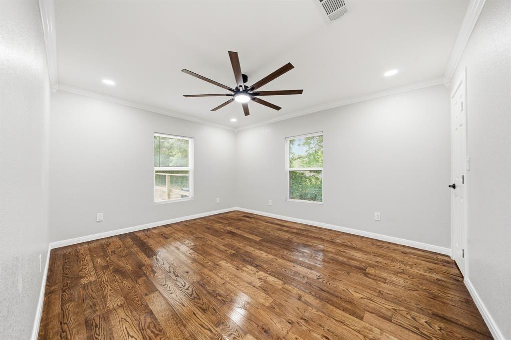 3313 South 3rd Street Waco, TX 76706 - Photo 13 of 28 wooden floor in an empty room with a window
