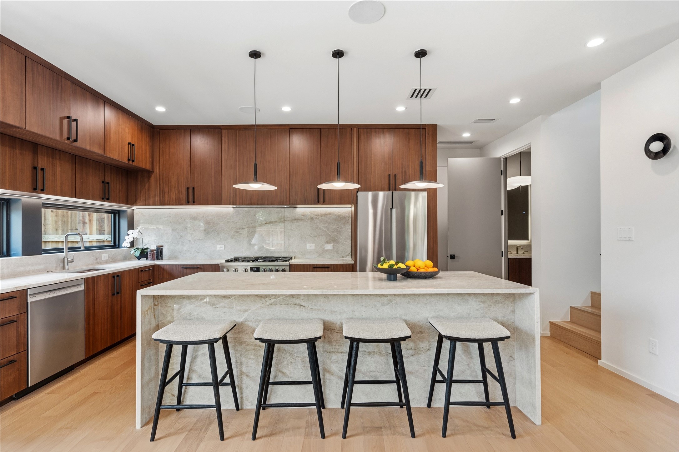 1912 South 3rd Street Austin, TX 78704 - Photo 2 of 21 a kitchen with a table chairs sink and cabinets