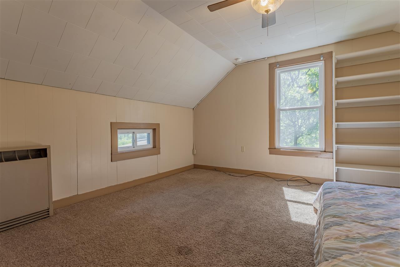9639 East River Road Ridott, IL 61067 - Photo 20 of 32 a view of an empty room with a window