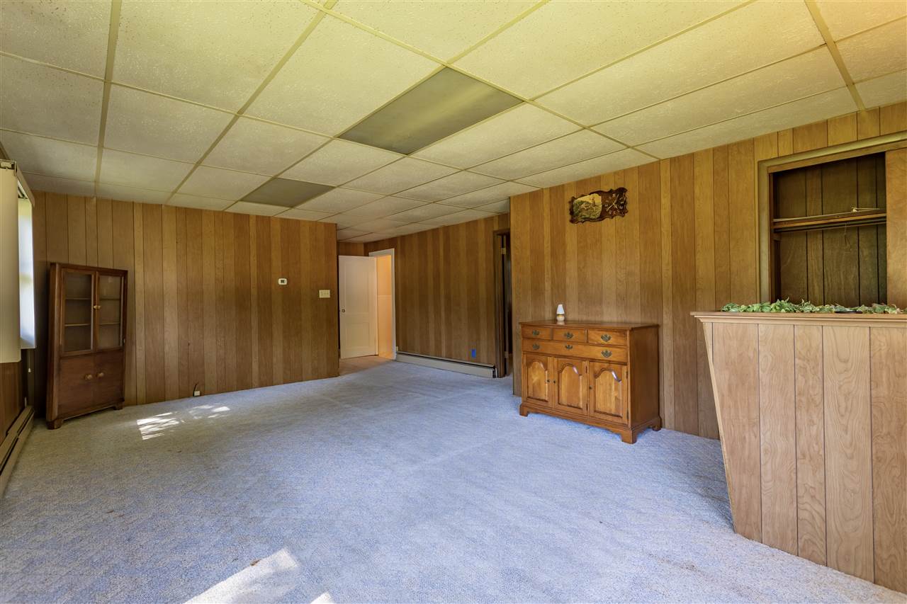 9639 East River Road Ridott, IL 61067 - Photo 3 of 32 a view of an empty room with wooden floor