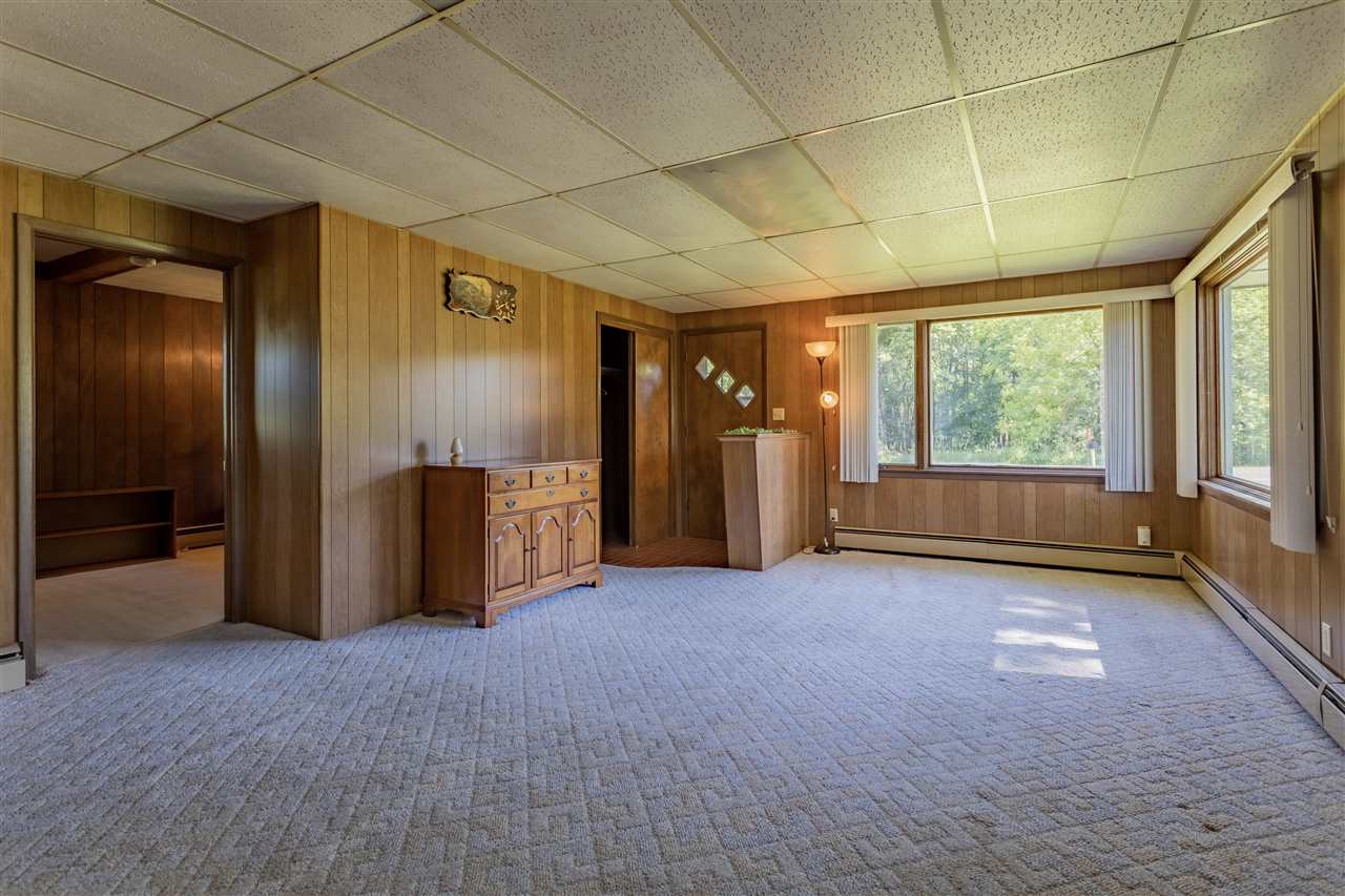 9639 East River Road Ridott, IL 61067 - Photo 4 of 32 wooden floor in an empty room with a window