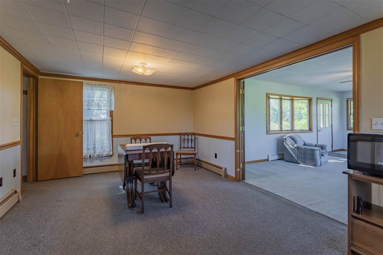 9639 East River Road Ridott, IL 61067 - Photo 10 of 32 a view of a livingroom with furniture and a couch