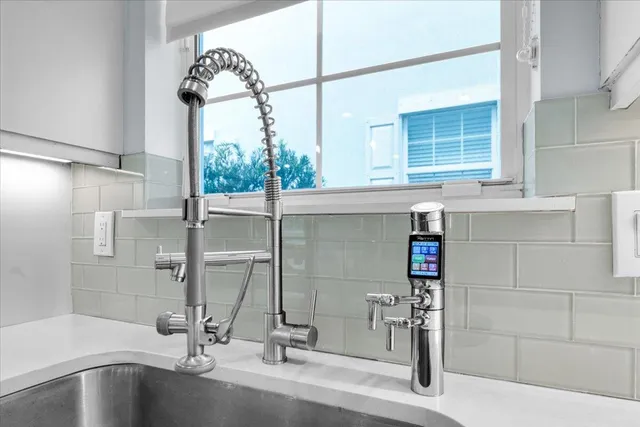 a bathroom with a tub and shower