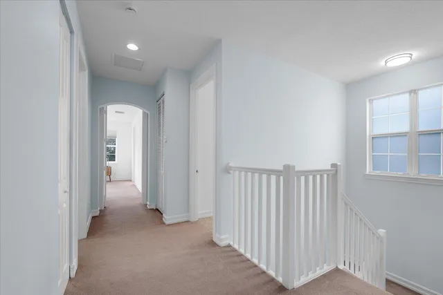 a view of a hallway with closet area