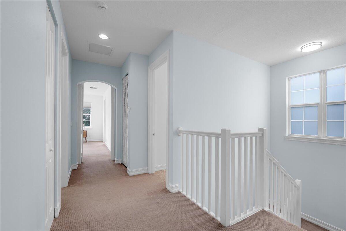 120 West Bay Cedar Circle Jupiter, FL 33458 - Photo 12 of 33 a view of a hallway with closet area