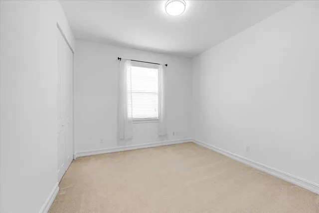 a utility room with cabinets washer and dryer
