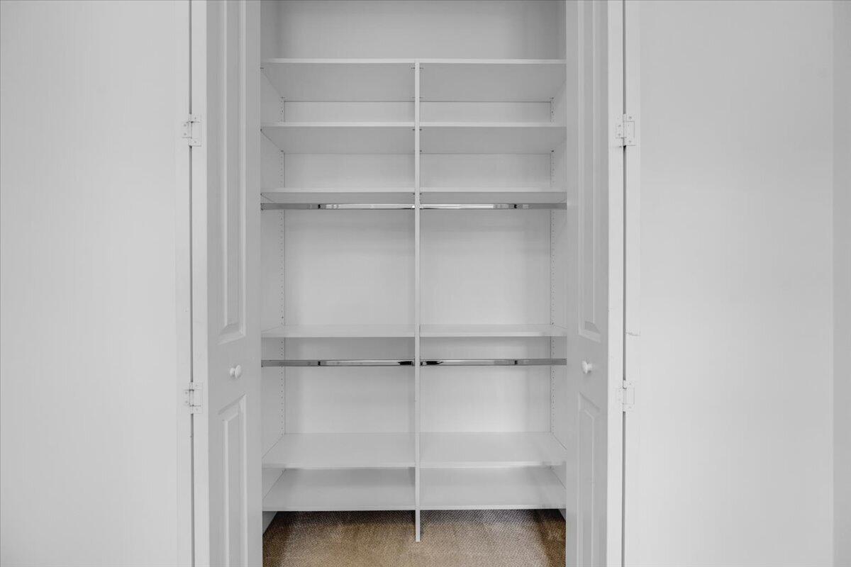 120 West Bay Cedar Circle Jupiter, FL 33458 - Photo 21 of 33 a view of an empty walk in closet