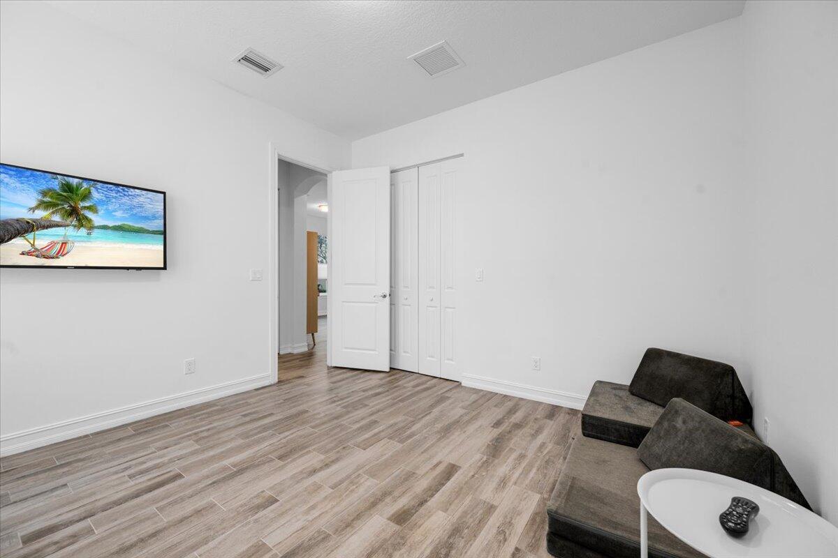 120 West Bay Cedar Circle Jupiter, FL 33458 - Photo 22 of 33 a view of an empty room and wooden floor