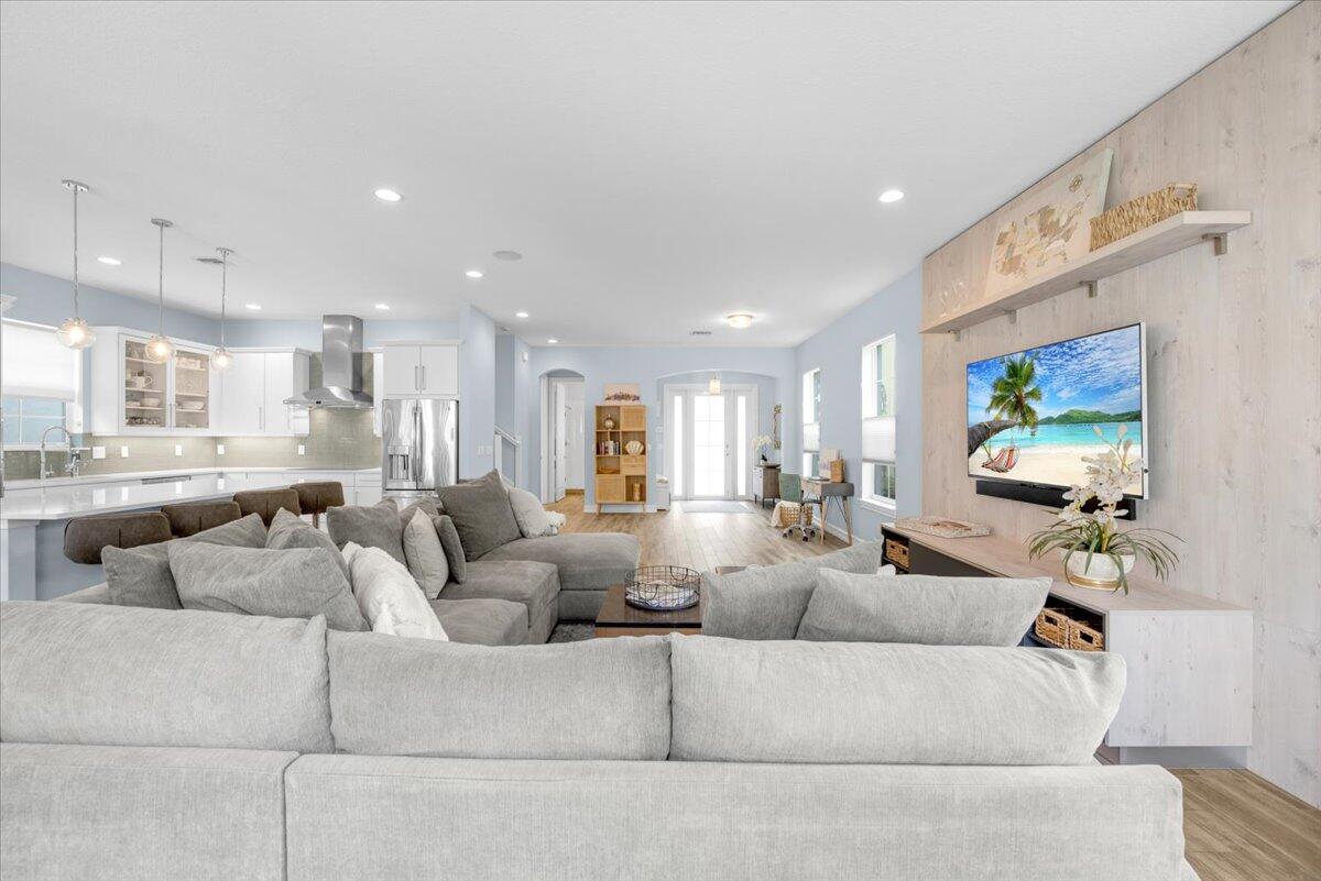120 West Bay Cedar Circle Jupiter, FL 33458 - Photo 5 of 33 a living room with furniture and a flat screen tv
