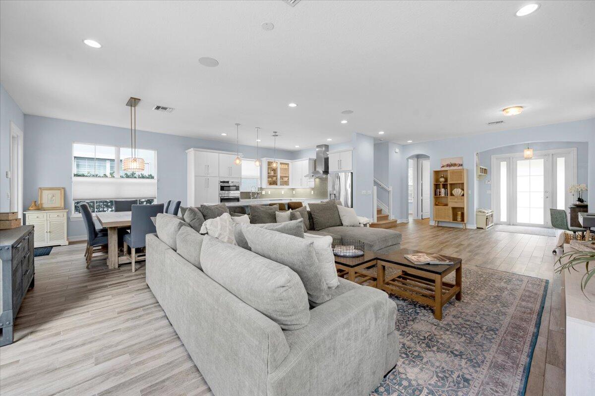 120 West Bay Cedar Circle Jupiter, FL 33458 - Photo 6 of 33 a living room with furniture kitchen view and a table