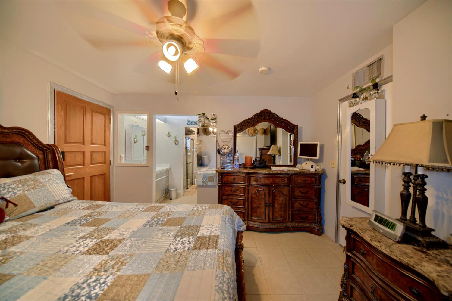 2013 Robertson Road Modesto, CA 95351 - Photo 7 of 24 a bedroom with a bed and flat screen tv