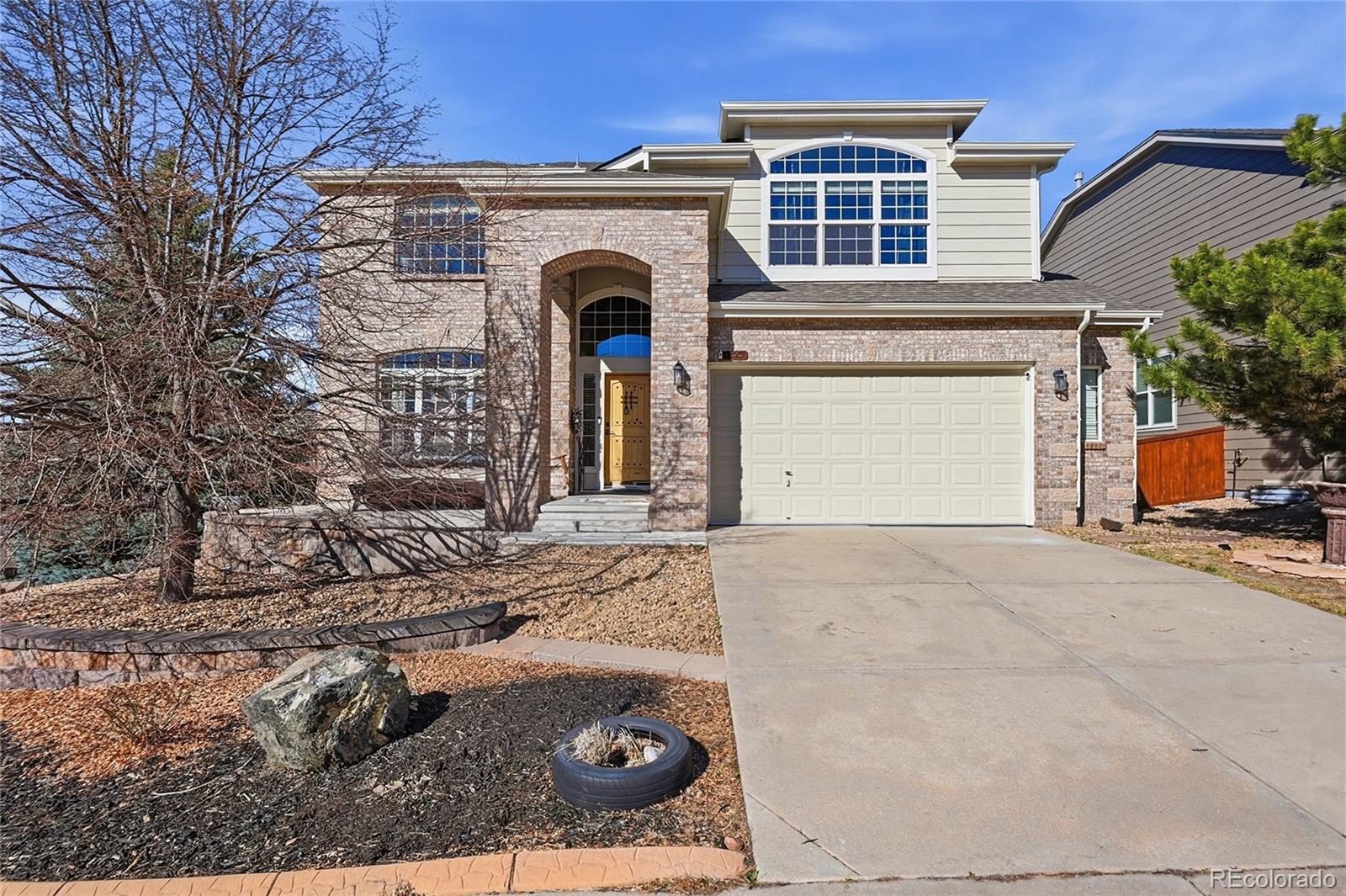 7869 Solstice Way Castle Rock, CO 80108 - Photo 1 of 41 a front view of a house with parking area