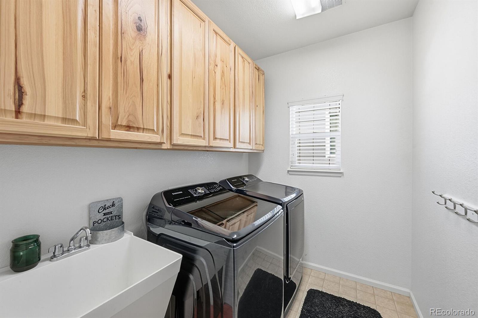 7869 Solstice Way Castle Rock, CO 80108 - Photo 16 of 41 a utility room with dryer and washer