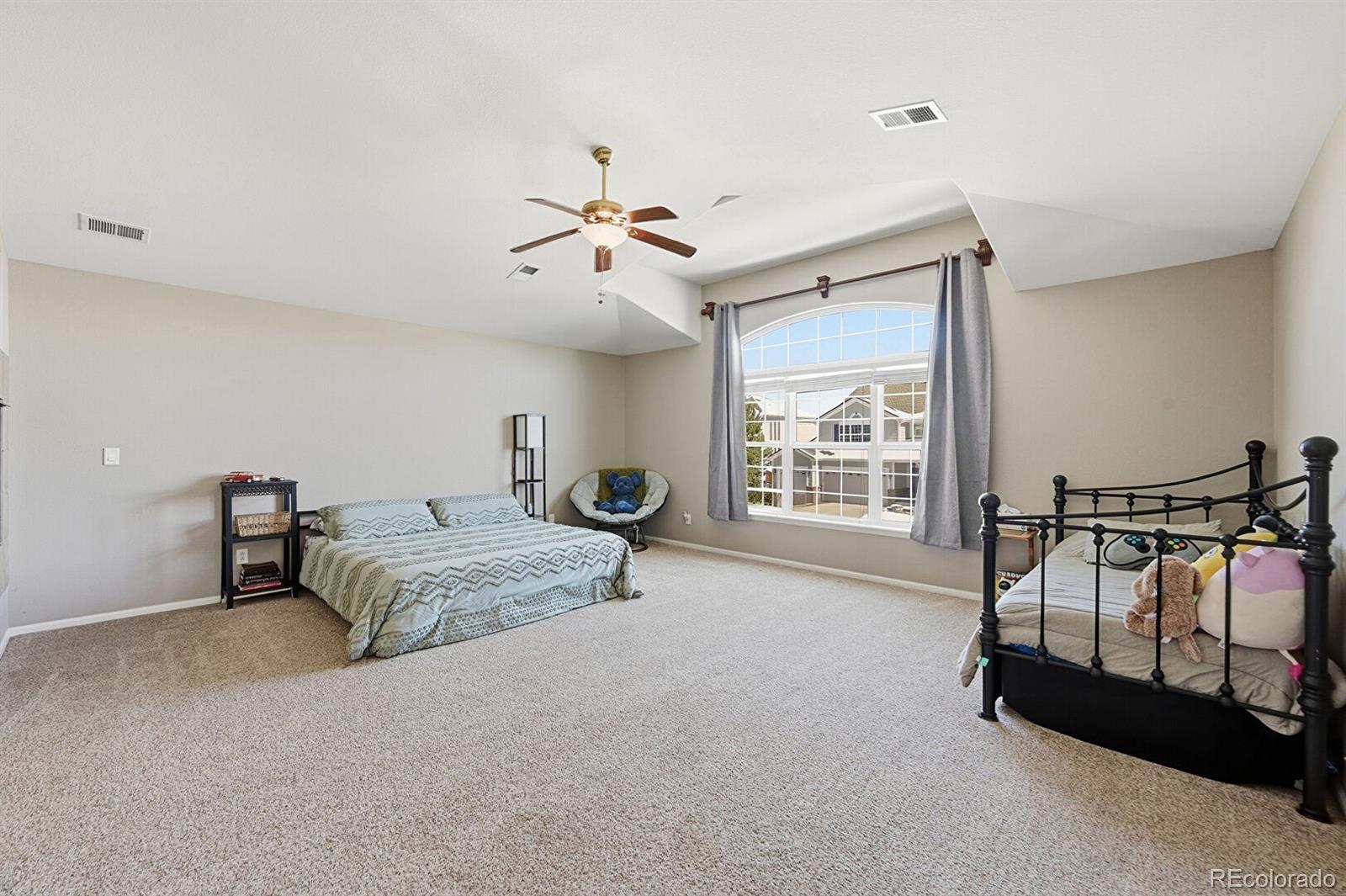 7869 Solstice Way Castle Rock, CO 80108 - Photo 18 of 41 a bedroom with furniture and a window