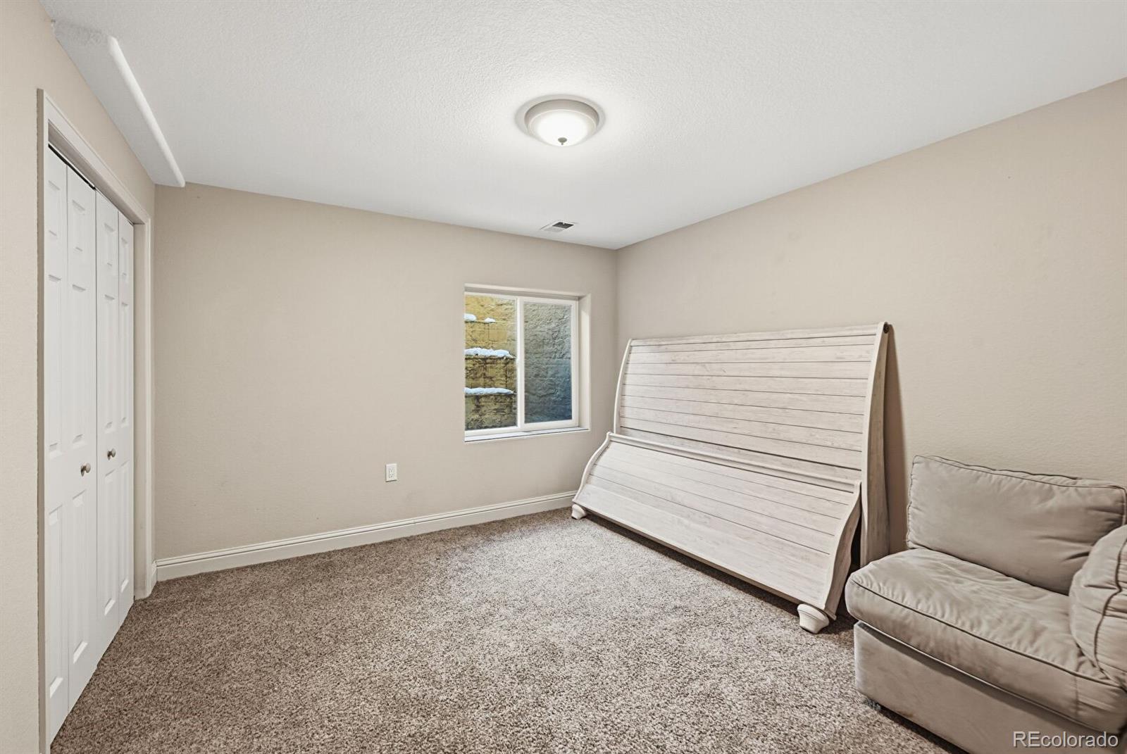 7869 Solstice Way Castle Rock, CO 80108 - Photo 37 of 41 a view of room with stairs and a window