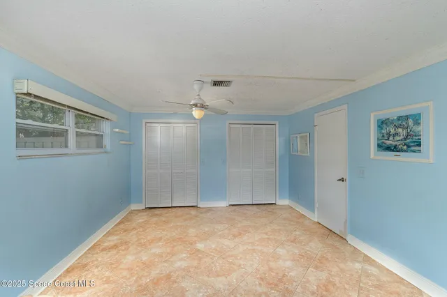 a view of empty room with windows