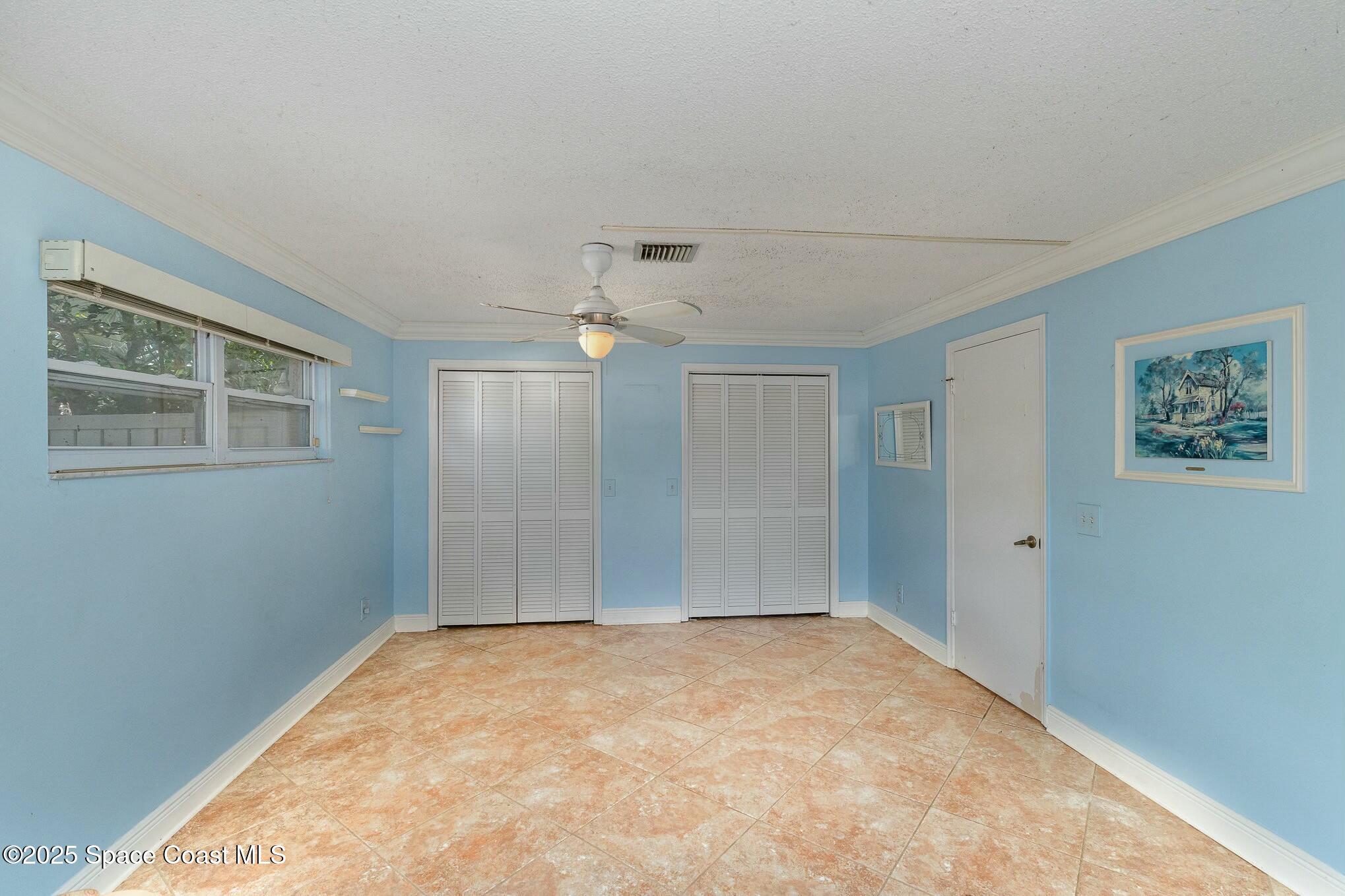 1351 Cherry Hills Road Northeast Palm Bay, FL 32905 - Photo 17 of 27 a view of empty room with windows