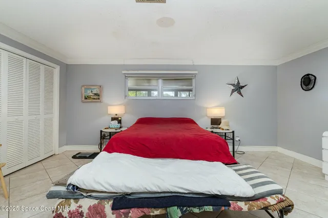 a bedroom with a bed and window