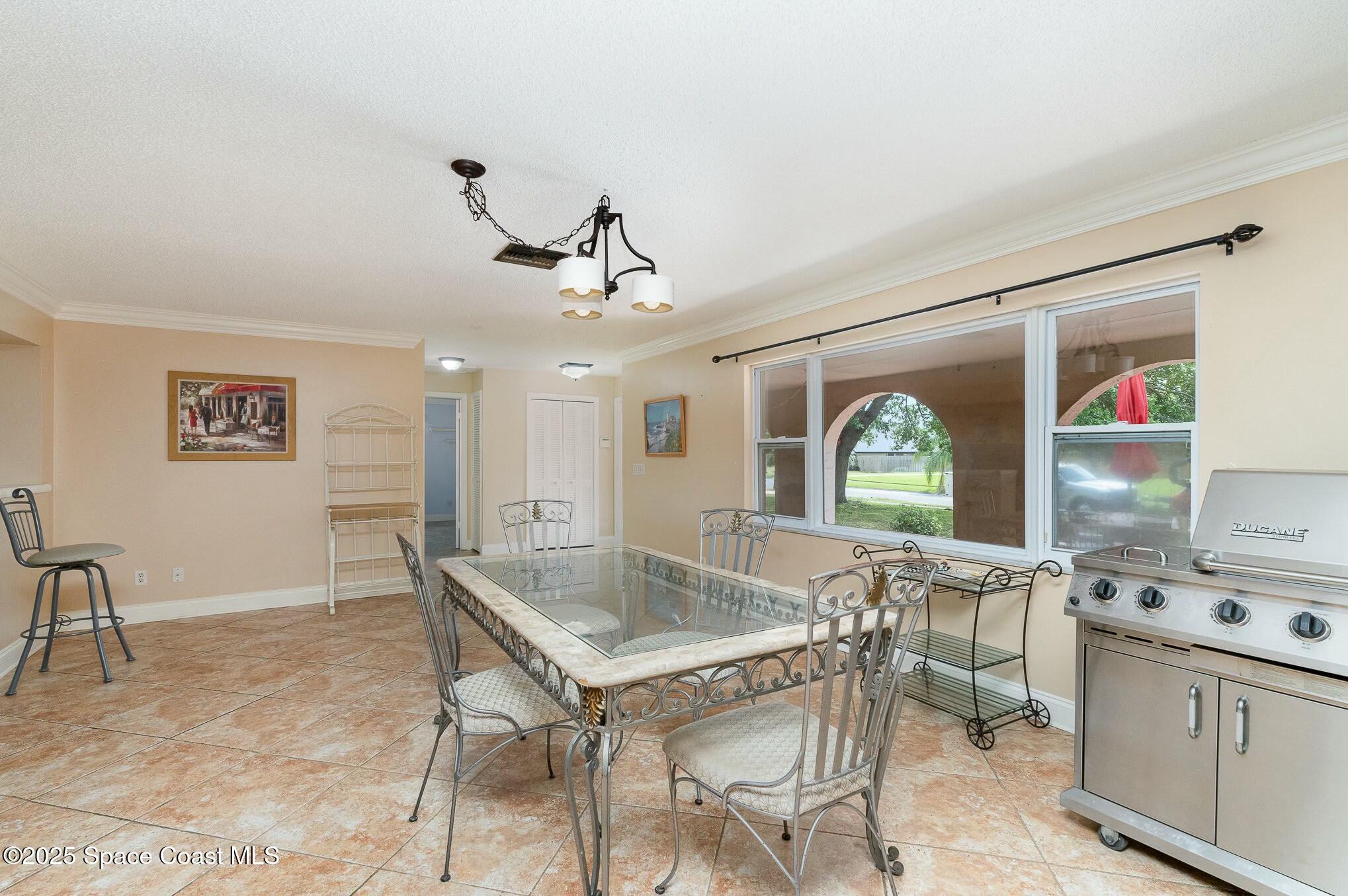 1351 Cherry Hills Road Northeast Palm Bay, FL 32905 - Photo 5 of 27 a view of a livingroom with furniture and window