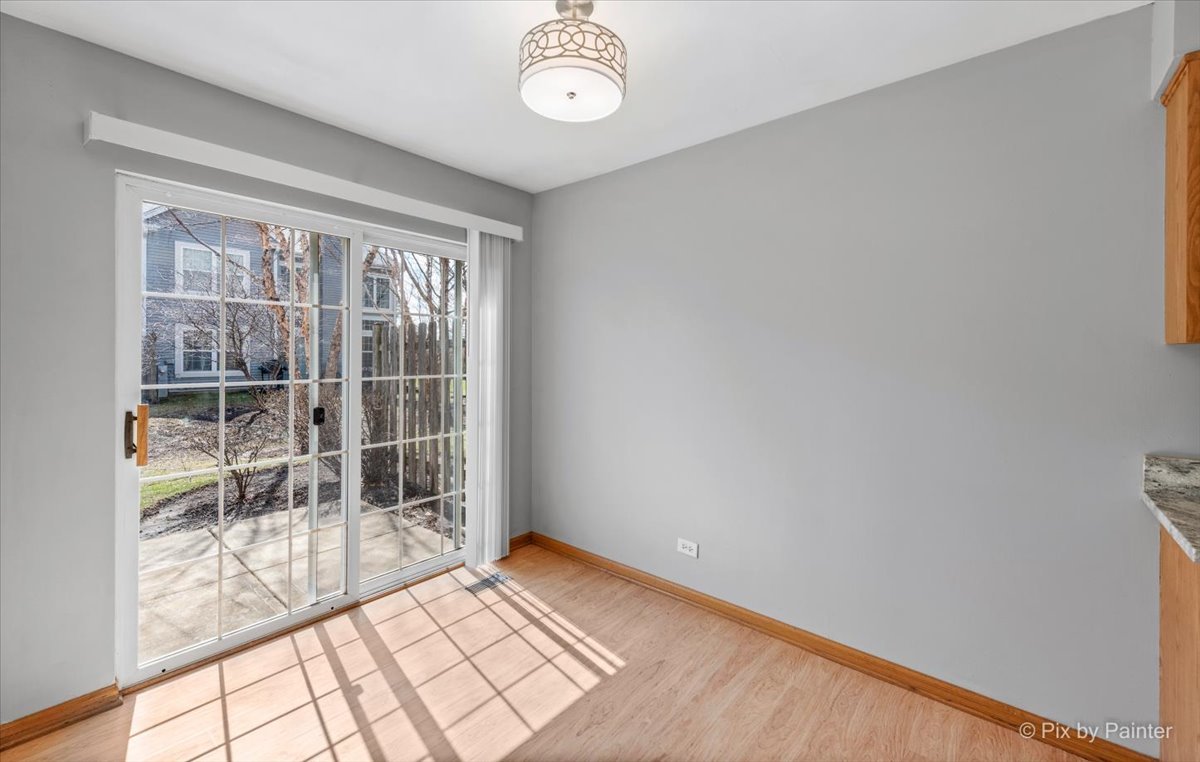 9433 Rainsford Drive, Unit 9433 Huntley, IL 60142 - Photo 14 of 30 an empty room with windows