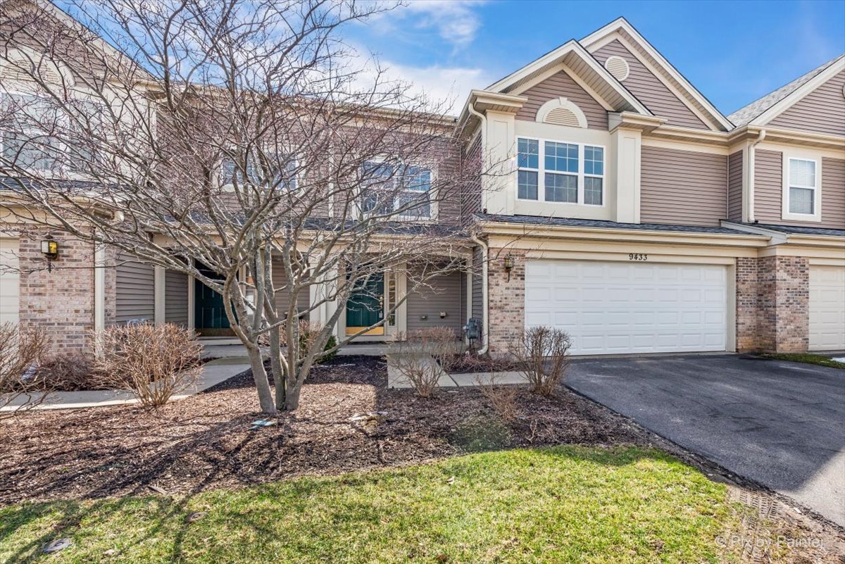 9433 Rainsford Drive, Unit 9433 Huntley, IL 60142 - Photo 2 of 30 a front view of a house with a yard