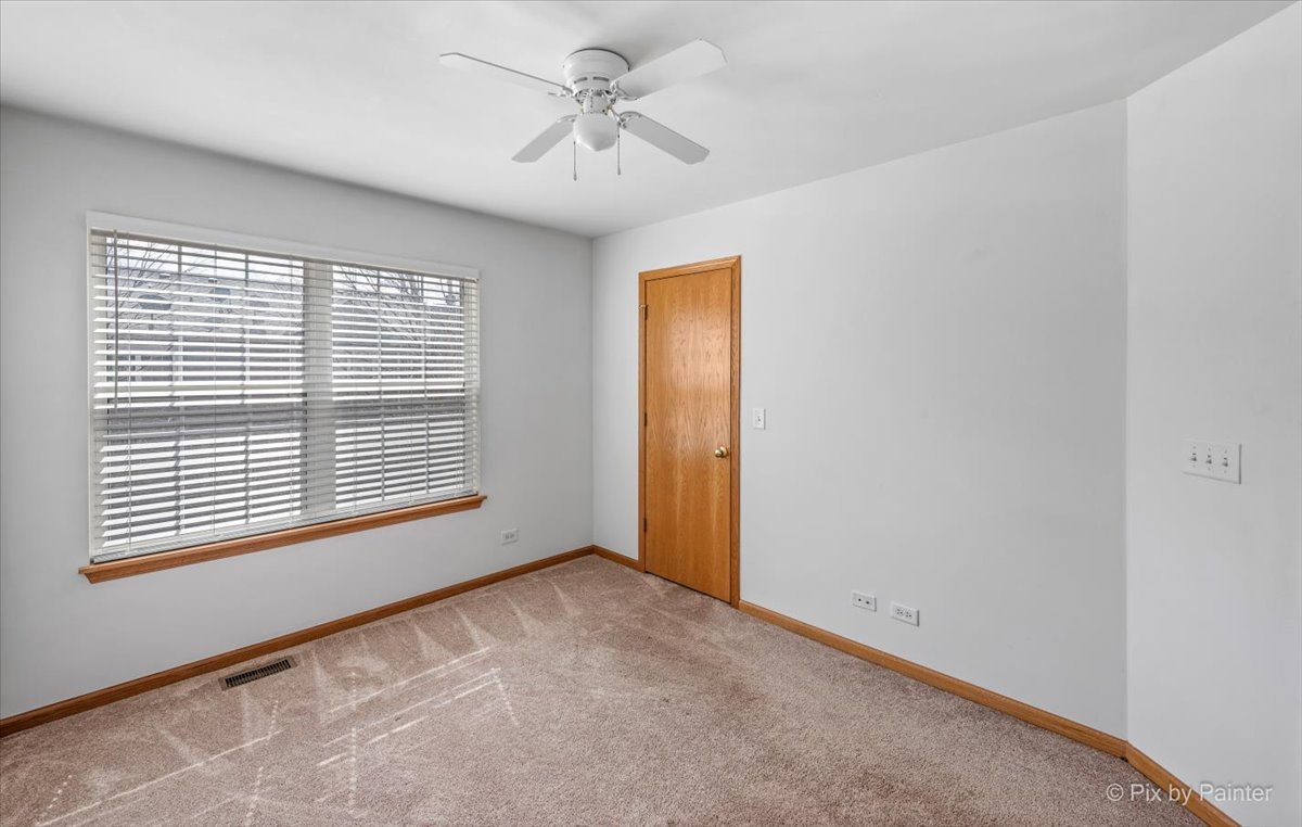 9433 Rainsford Drive, Unit 9433 Huntley, IL 60142 - Photo 24 of 30 a view of an empty room with a window
