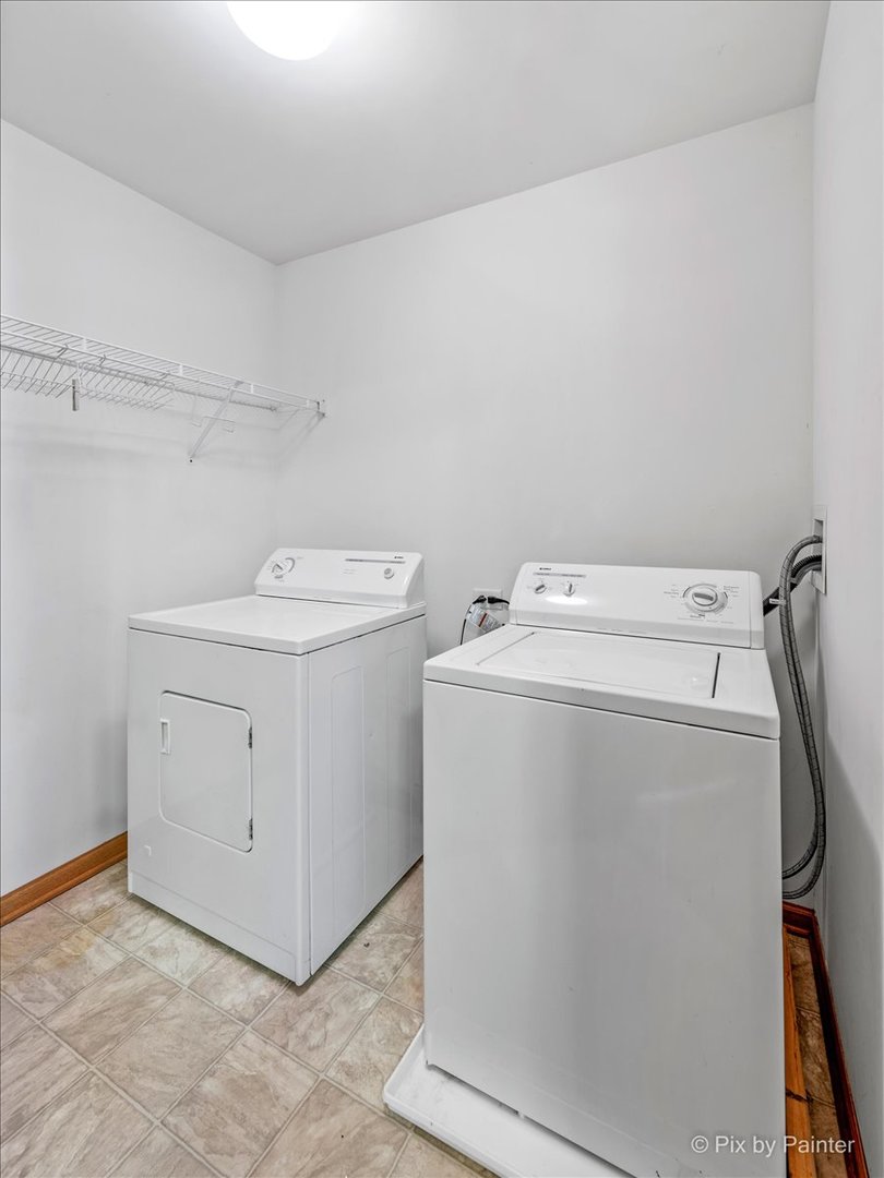 9433 Rainsford Drive, Unit 9433 Huntley, IL 60142 - Photo 26 of 30 a utility room with dryer and washer