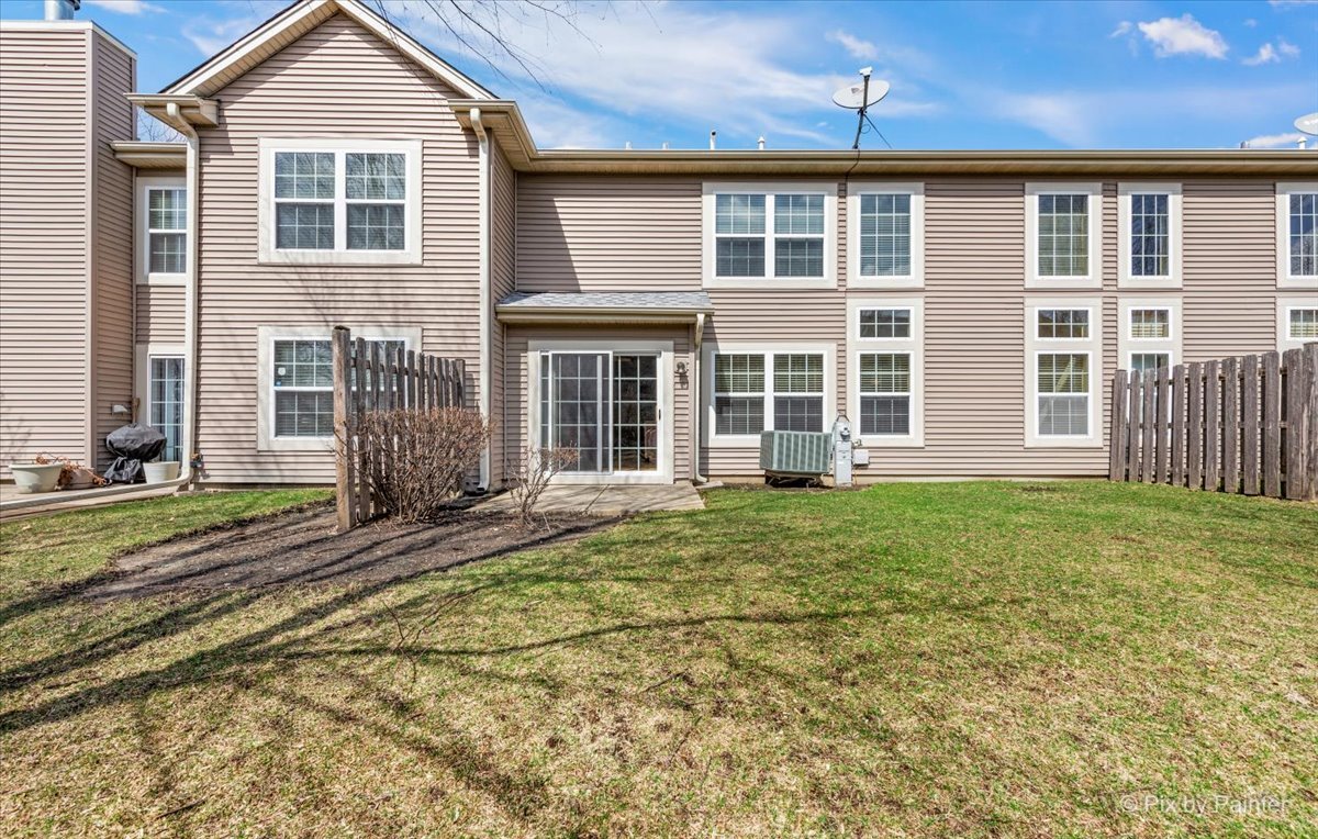 9433 Rainsford Drive, Unit 9433 Huntley, IL 60142 - Photo 28 of 30 front view of a house with a yard