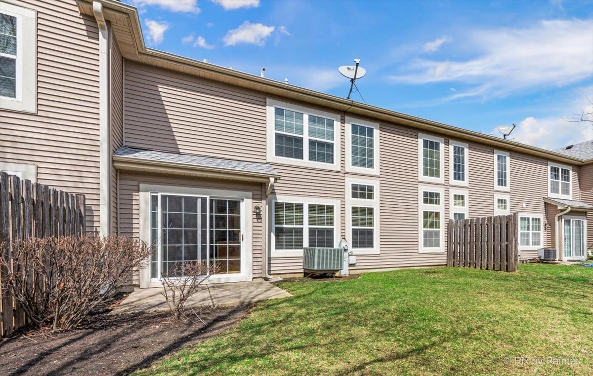 9433 Rainsford Drive, Unit 9433 Huntley, IL 60142 - Photo 29 of 30 a front view of a house with a yard