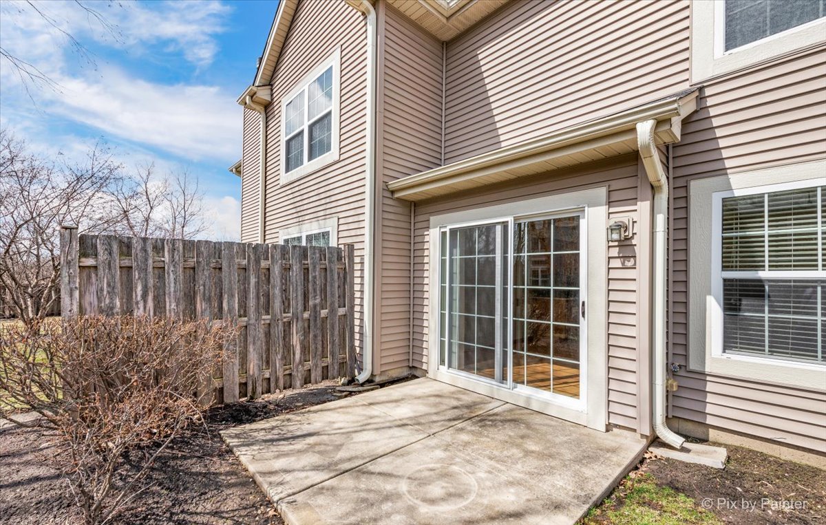 9433 Rainsford Drive, Unit 9433 Huntley, IL 60142 - Photo 4 of 30 a view of a house with a large window