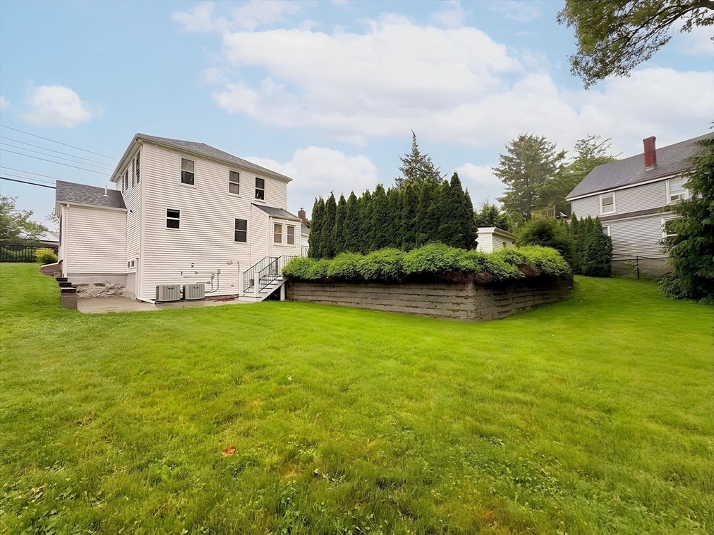 114 Curve Street Dedham, MA 02026 - Photo 27 of 27 a view of a backyard with plants and large trees