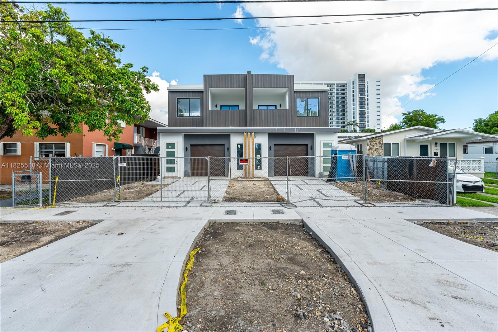 3187 Southwest 23rd Street, Unit A Miami, FL 33145 - Photo 1 of 18 a view of a brick building next to a yard
