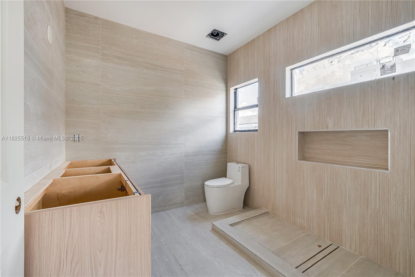 3187 Southwest 23rd Street, Unit A Miami, FL 33145 - Photo 7 of 18 a bathroom with a toilet