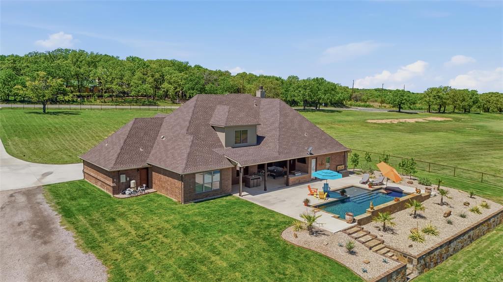 10106 Prather Road Springtown, TX 76082 - Photo 5 of 40 an aerial view of a house with garden space and street view