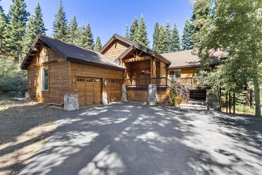 11347 Ski Slope Way Truckee, CA 96161 - Photo 2 of 21 a view of a house with a yard and garage