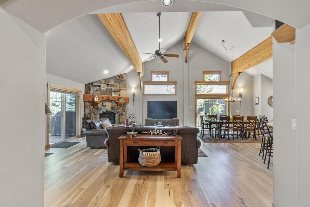 11347 Ski Slope Way Truckee, CA 96161 - Photo 4 of 21 a living room with furniture a fireplace and a flat screen tv