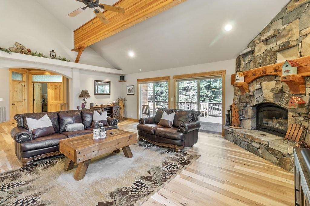 11347 Ski Slope Way Truckee, CA 96161 - Photo 5 of 21 a living room with furniture a fireplace and a floor to ceiling window