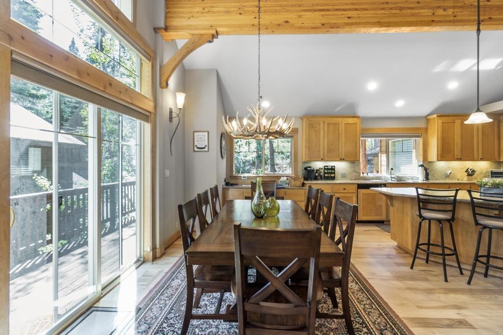 11347 Ski Slope Way Truckee, CA 96161 - Photo 8 of 21 a dining room with furniture a chandelier and wooden floor